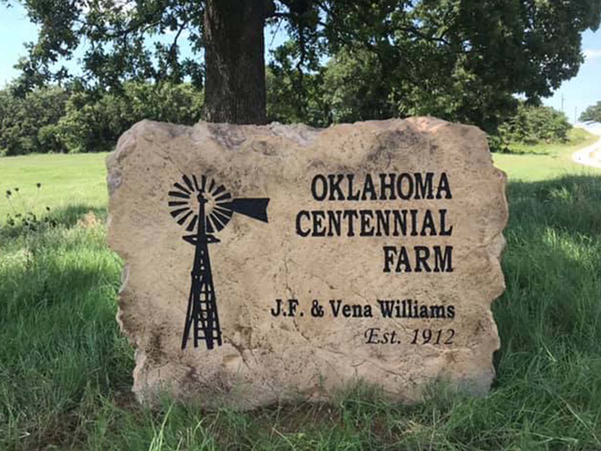 carved rock with farm name on it